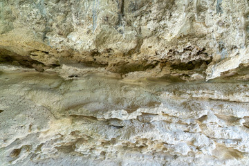 Fototapeta na wymiar Sandstone. The structure of natural stone. Natural erosion. Background.