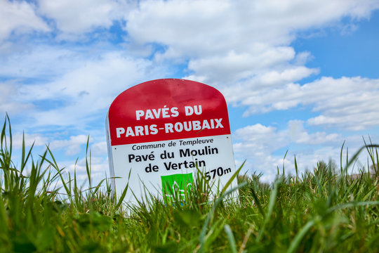 Templeuve,France- April 5, 2014:Image of a specific milestone indicating the start of a cobbelstone road included in the route of Paris Roubaix cycling race.