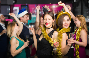 Young females and males celebrating new year
