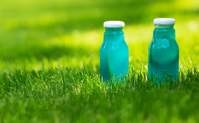 Blue fresh water of natural components in grass with sun lights