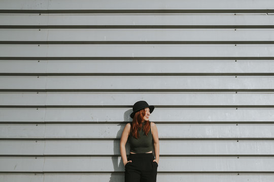Woman leaning on wall
