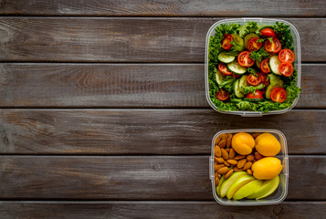 salad to go in lunch box on wooden background top view space for text