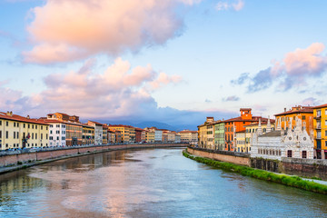 Colorful houses and church Santa Maria della Spina  on the banks of river Arno in Pisa, Tuscany, Italy