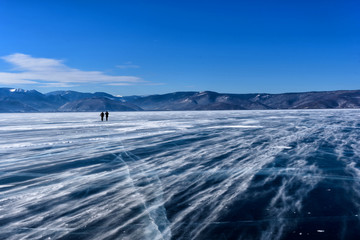 Frozen Lake Baikal. Beautiful mountain near the ice surface on a frosty day. Natural background