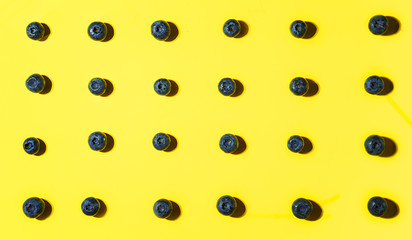 Fresh blueberry on yellow background.