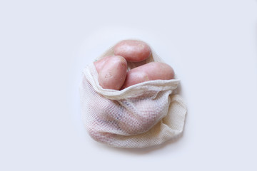 Potato in grocery bag. Clean eco friendly fresh white vegetables/