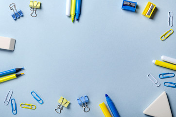 Yellow and blue pencils and felt-tip pens. Top view with copy space.