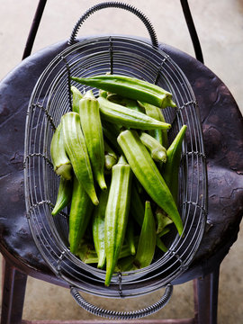 Overhead view of okras in basket