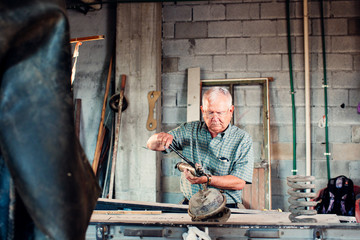 Man repairing a device in workshop