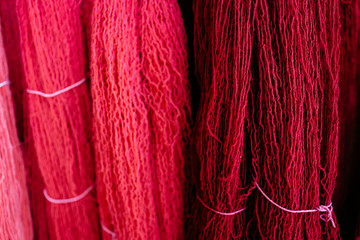 Close up of two different colors of wool