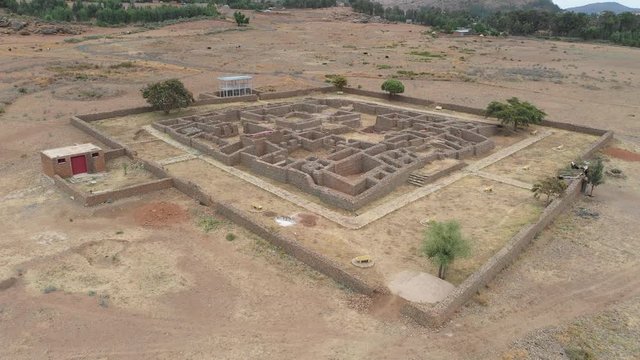 Ascending tilting drone shot of remains of spectacular Dungur Mansion (Palace of the Queen of Sheba), cultural heritage in Aksum city in Northern Ethiopia