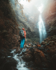 man in the waterfall