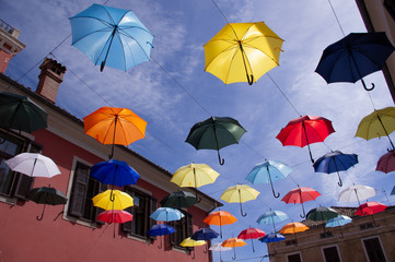 colorful umbrellas on the background of blue sky