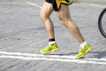 feet running athlete on the course. sport and health.