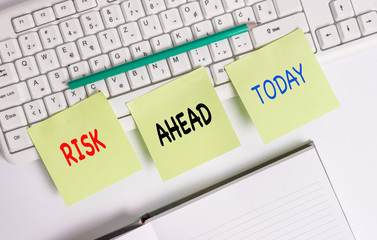 Word writing text Risk Ahead. Business photo showcasing A probability or threat of damage, injury, liability, loss Three empty green square papers by the pc keyboard with copy space