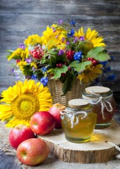 Honey and Herbal tea on wooden background - summer, health and organic food concept