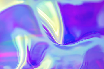 Abstract trendy holographic background in 80s style. Blurred texture in violet, pink and mint...
