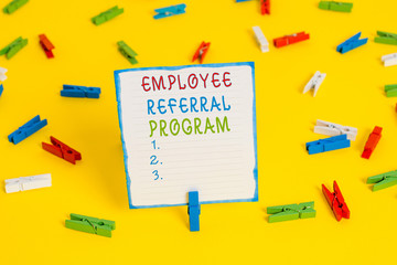Handwriting text Employee Referral Program. Conceptual photo employees are rewarded for introducing recruits Colored clothespin papers empty reminder yellow floor background office