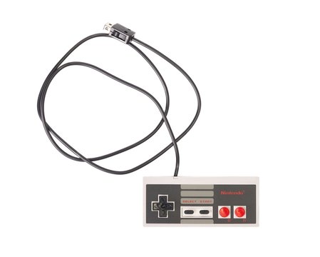 BUDAPEST, HUNGARY - DECEMBER 10, 2017: Nintendo NES classic controller hanging from above. One of the most classic gaming consoles