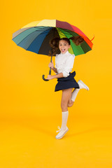 School time. Rainbow style. Colorful life. Schoolgirl happy with umbrella. Fall weather forecast. Fashion accessory. Umbrella protective shield. Girl with umbrella. Rainy day walks. Happy childhood