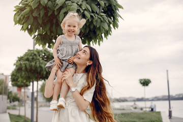 Obraz premium Mother with daughter. Family in a park. Cute little girl