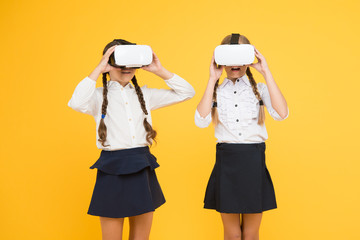It is so real. children wear wireless VR glasses. Happy kids use modern technology. future education. back to school. Digital future and innovation. virtual reality. small girls in VR headset