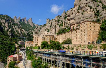 Montserrat / Spain - June 2018: View on Santa Maria de Montserrat Abbey and surrounding mountains...