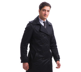 Young businessman wearing winter coat isolated on white