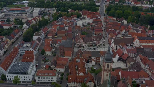 Aerial of the city Tauberbischofsheim in Germany. Flying over the old town with tilt down at the end.