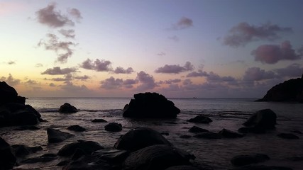 Fernando de Noronha Island, a UNESCO World Heritage site, Pernambuco, Brazil - July, 2019 - 4k footage of colorful sunset at Cachorro Beach with the beautiful view of the Pico Hill, Conceição Beach.