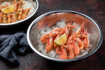 boiled shrimp on ice on dark concrete rustic table
