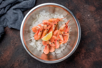 boiled shrimp on ice on dark concrete rustic table