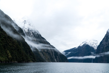 waterfall and low cloud in Milford Sound