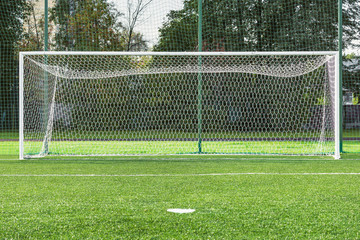 View of the football gate by the green grass field.