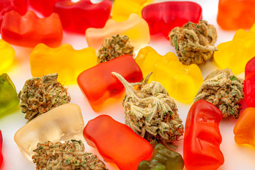 Cannabis edibles, medical marijuana, CBD infused gummies and edible pot concept theme with close up...