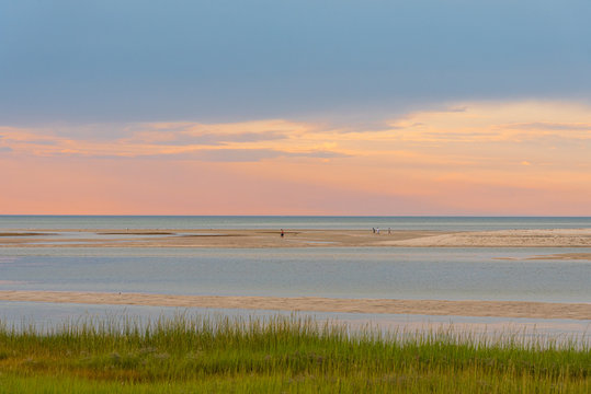 Vacationing Tourists Enjoy the Cape Cod Bay under a Pastoral Pastel August Sunset