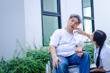 Asian guy, white hair, sick, paralyzed, unable to walk, must sit on a wheelchair Have a wife to...