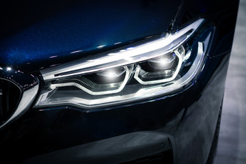 Fototapeta na wymiar Headlight car Projector/LED of a modern luxury technology