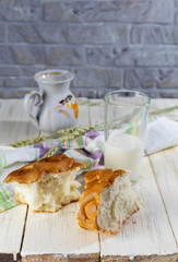 Delicious Breakfast on a wooden table. Still life of slices of bread, milk and wheat. The concept of Breakfast.