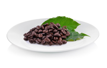Coffee beans and Coffee leaf isolated on white plate