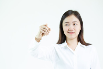 Asian women in casual white shirt and using a pen writing in the air close up.  Woman in business concept background.