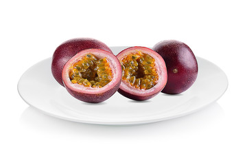 Passion fruit isolated on white plate