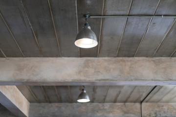 Ceiling lamp in the building that decorated in loft and industrial style close up.