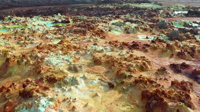 Aerial view of surreal pools of acid sulfuric minerals at Dallol volcanic crater in the Danakil depression, beautiful natural landscape in Ethiopia Africa