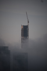 skyscraper in fog