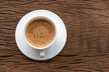 Coffee cup with text  Business start  motivational handwriting on wood backgrorud