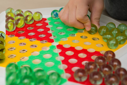 kid playing checkers horizontal composition