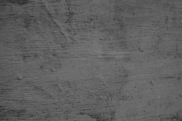 Texture of a concrete wall with cracks and scratches which can be used as a background
