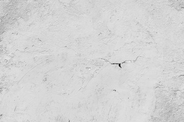 Texture of a concrete wall with cracks and scratches which can be used as a background