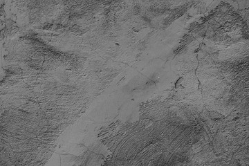 Texture of a concrete wall with cracks and scratches which can be used as a background